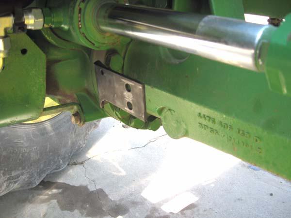 Note: A breaker bar may be necessary to loosen this bolt. Figure 3-12 Remove Top Bolt on Steering Axle Case 3.