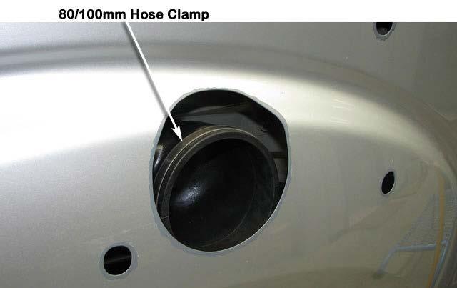 Rotate the assembly towards the front of the vehicle until the hose is completely through.