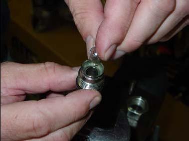 Remove the 18mm fuel rail valve located on the front of the fuel rail. 2. Take valve and thread supplied nut tool onto valve.