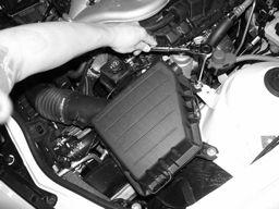 Figure 4 Pull the engine cover out from the