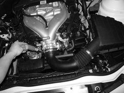 10 Loosen the throttle body clamp over the