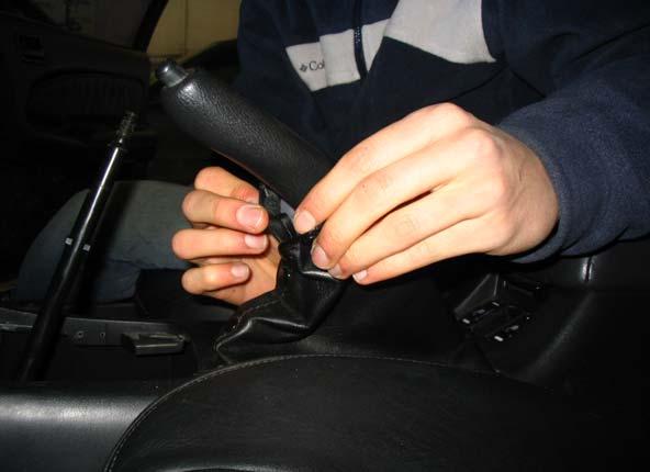 If you have leather boot partially covering your handbrake lever, it may be necessary to unsnap it (from below). 6.