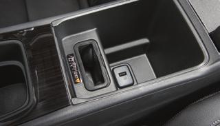 Place the device in the pocket with the screen facing the rear of the vehicle. 4. The charging symbol will appear on the infotainment screen when charging.