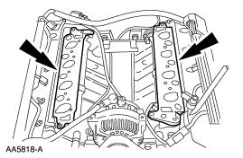 Position the gaskets. 2. CAUTION: If the PCV system hose becomes disconnected, the intake manifold will have to be removed to reattach the hose.