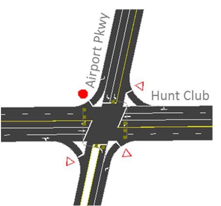 The northbound approach consists of a single left-turn lane and a shared through/right-turn lane.