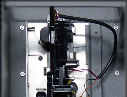 Installing the ST-810 plus-mech 1. Install the new ST-810 plus-mech on the same mounts used by the old coin mechanism. 2. The locking latch is on the upper left corner of the backplate.
