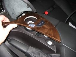 Next, use your fingers and a panel tool (if necessary) to unclip the shifter trim from the console.