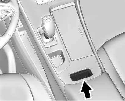 Instruments and Controls 109 To charge a mobile device: 1. Remove all objects from the charging pocket. The system may not charge if there are any objects between the phone and the charging pocket. 2.