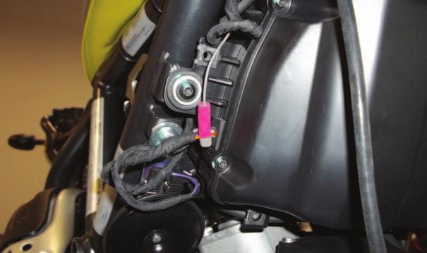 Be sure to keep the PCV wiring harness free and clear of any hot or moving parts.