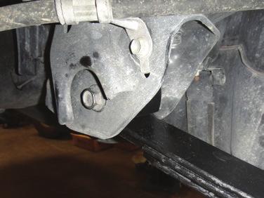 Install the U-bolts and tighten. [FIGURE 4] 15. Connect the parking brake brackets to the axle using a 12mm and the factory bolt. 16.