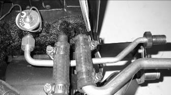 Attach the shortest of the tubes to the rear heater connection using (1) piece of hose and (2) worm gear clamps.