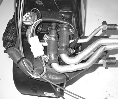 Attach the wire harness to the blower motor.