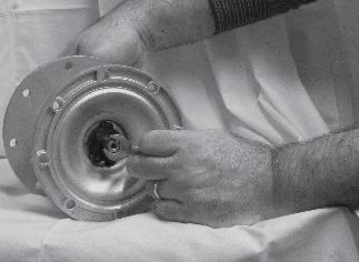 Placing the ¾ inch wrench on the remaining Outer Diaphragm Plate, and the 7/16 inch