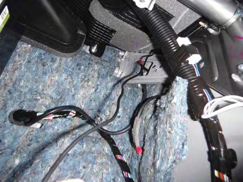 Continue to route the XM antenna cable down the passenger s front pillar, securing with