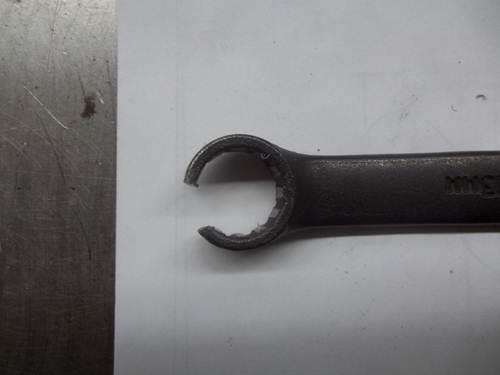 8) Cable clip shown in line with opening Fig. 8 9. A modified wrench (Fig.
