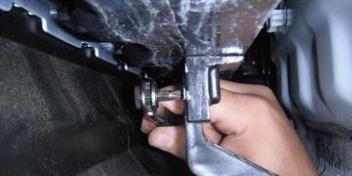 Remove the underbody panel on the driver side with a straight screw driver and a mm socket.
