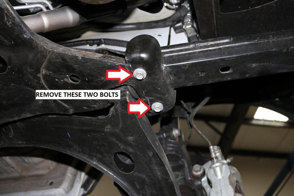 25) Next, remove the bumper support bars from the vehicle.