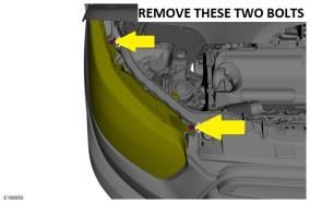 11) In the engine compartment, locate the two torx bolts securing the headlight housings to