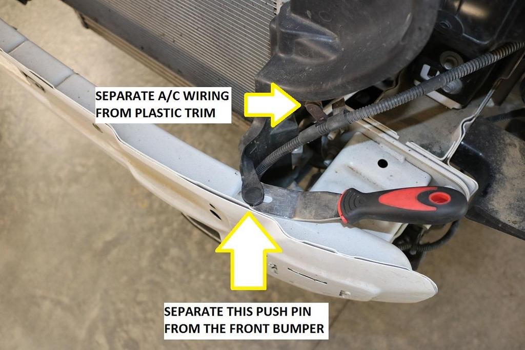 support using an automotive trim removal tool as shown below. a. Note, remove this push pin on both the driver and passenger side of the vehicle.