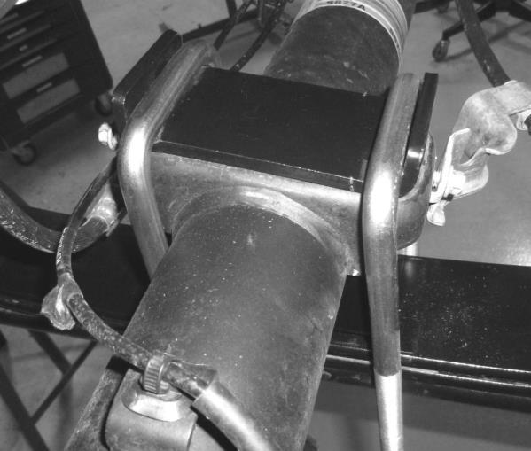 3e) Lower the axle into the saddles ensuring the two tabs are positioned up inside the factory spring mount.