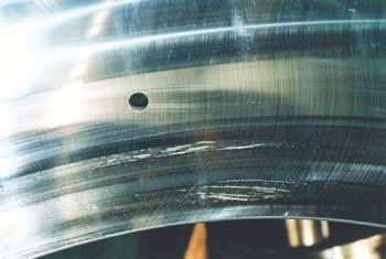 Outer ring of Photo 4-5 Partial smearing occurs circumferentially on raceway surface Poor lubrication Photo 4-1 Inner ring of a cylindrical roller bearing Smearing occurs circumferentially on raceway