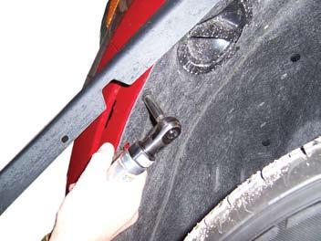 Carefully pull facia out on each side by fender and pull facia forward to remove.