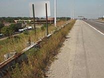Obstructed signs can be problematic because the traveling public is not being informed of a condition that warrants a sign. Guardrail is by design a hazard and must be visible to drivers.