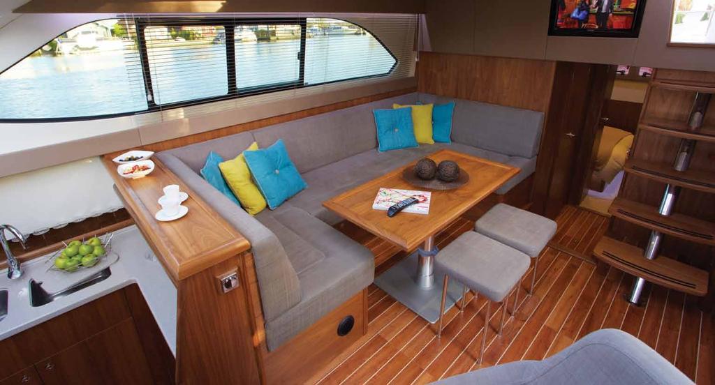 FORWARD CABIN Large double berth or twin V-berth arrangement, with drawers below, hanging wardrobes to port, and starboard shelving around berths.