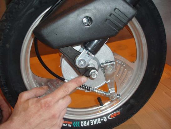 Secure with nut n right side (brake side) and tighten