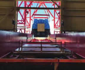 The stator was lowered to Barnhart s 5-foot girders and slid across the turbine floor to the wall opening where the 650-ton strand jack lift system took over.