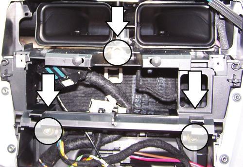 Cut the shaded area in the sub-dash to allow room for the aftermarket radio.