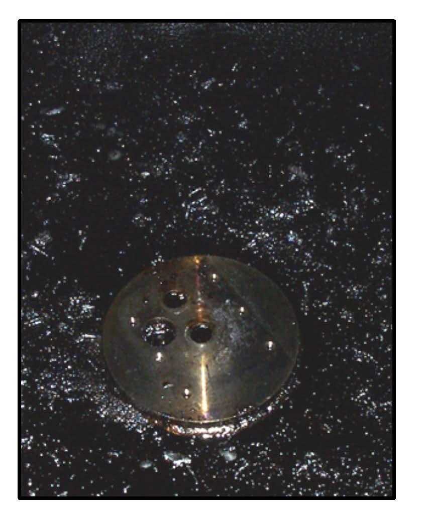 Chapter 6 Maintenance Instructions Step Table 6-15 Material Pump Replacement (continued) Action 17 Clean any sealant from the top of the pump mounting plate and clean the shaft holes. (See Fig.