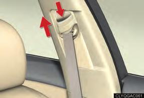 To lower: push the head restraint down while pressing the lock release button.