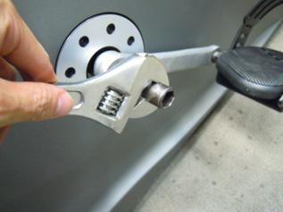 crank (the tool acts as a socket) to the drive axle and remove the nut