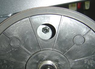 2) The tension assembly is held to the frame by one bolt and nut (Figures A & B).