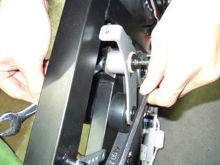 4) Remove the bolt and nut holding the tension assembly to the frame and remove it (Figure D).