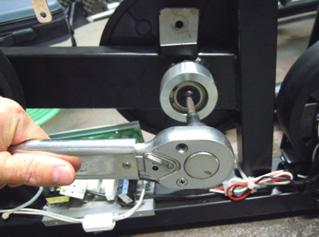 3) Pull up on the tension assembly and remove the drive