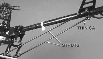 Slide the rudder pushrod back through both supports on the tail boom.