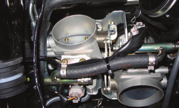 throttle bodies (Fig. A). FIG.B 5 the stock wiring harness from each injector (Fig. B). Ground wire Remove FIG.