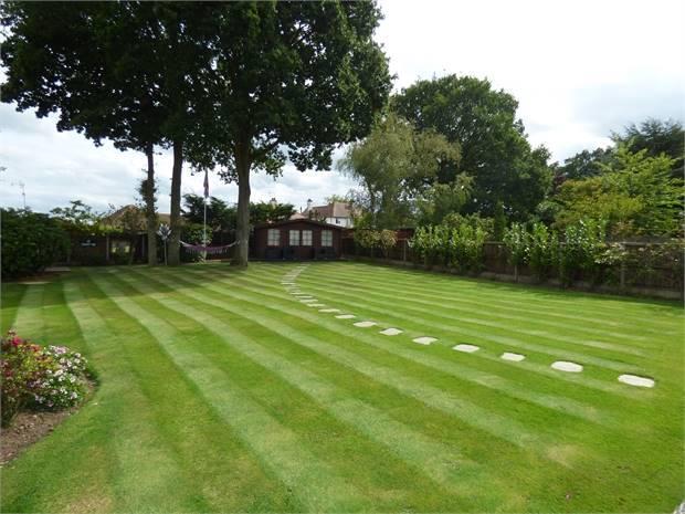 mainly laid to lawn, mature shrub boarders, gated side aspect, 3 x wood