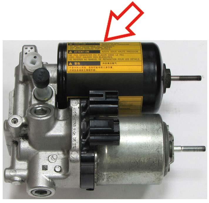 2. INSPECT THE ORIENTATION OF THE ACCUMULATOR CAUTION LABEL a) Inspect the orientation of the caution label to determine if the accumulator requires replacement.