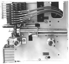 Remove the two screws holding the breaker side plate in place, as shown in Figure 13. 1 4.
