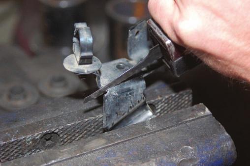 53. Install the supplied brake line relocation bracket on the upper control arm mount with the stock hardware.