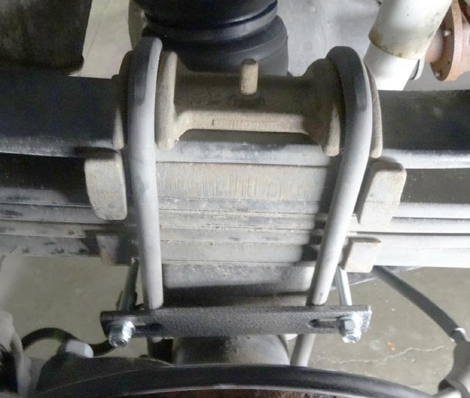 in the 2nd slot from the edge of the bracket (F), beside the carriage bolt previously