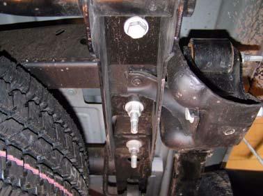 b. Remove six bolts and six nuts, bumper, and bumper brackets from frame.