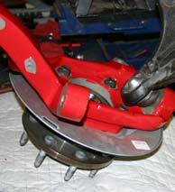 Attach the ABS line & brake line bracket to the new Skyjacker steering knuckle using the OEM hardware &10mm wrench.