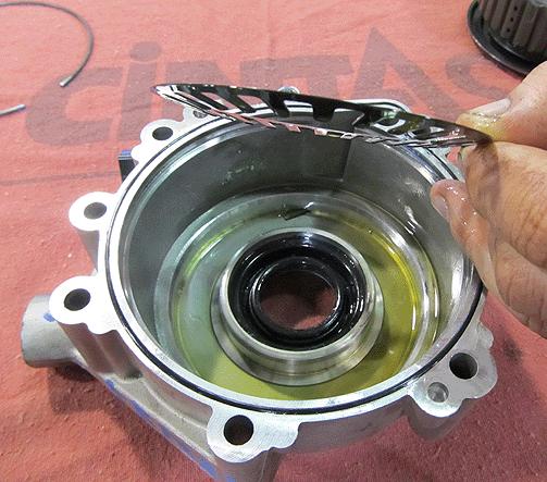 Note: If the piston spring is removed, ensure proper orientation when reinstalling. Spring fingers must be positioned as shown above. 13. Install the new elsd clutch piston into the housing.