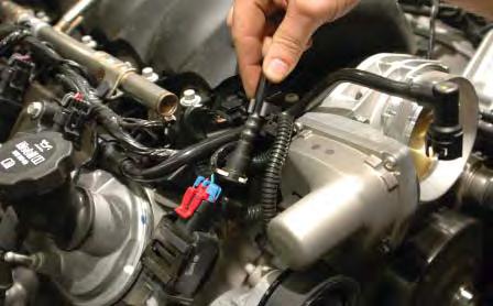 Release the vent tube at the top of the EVAP solenoid by pushing in on the