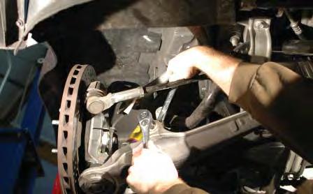 Remove the nuts that secure the sway bar end links to the lower A-arms on both sides