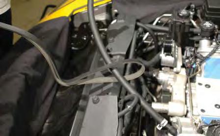121. Pass the 5/8 hose through the center of the new serpentine drive belt.